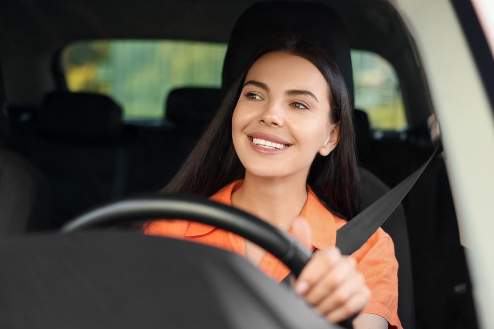 Enjoying,Trip.,Happy,Young,Woman,Driving,Her,Car,,View,Through